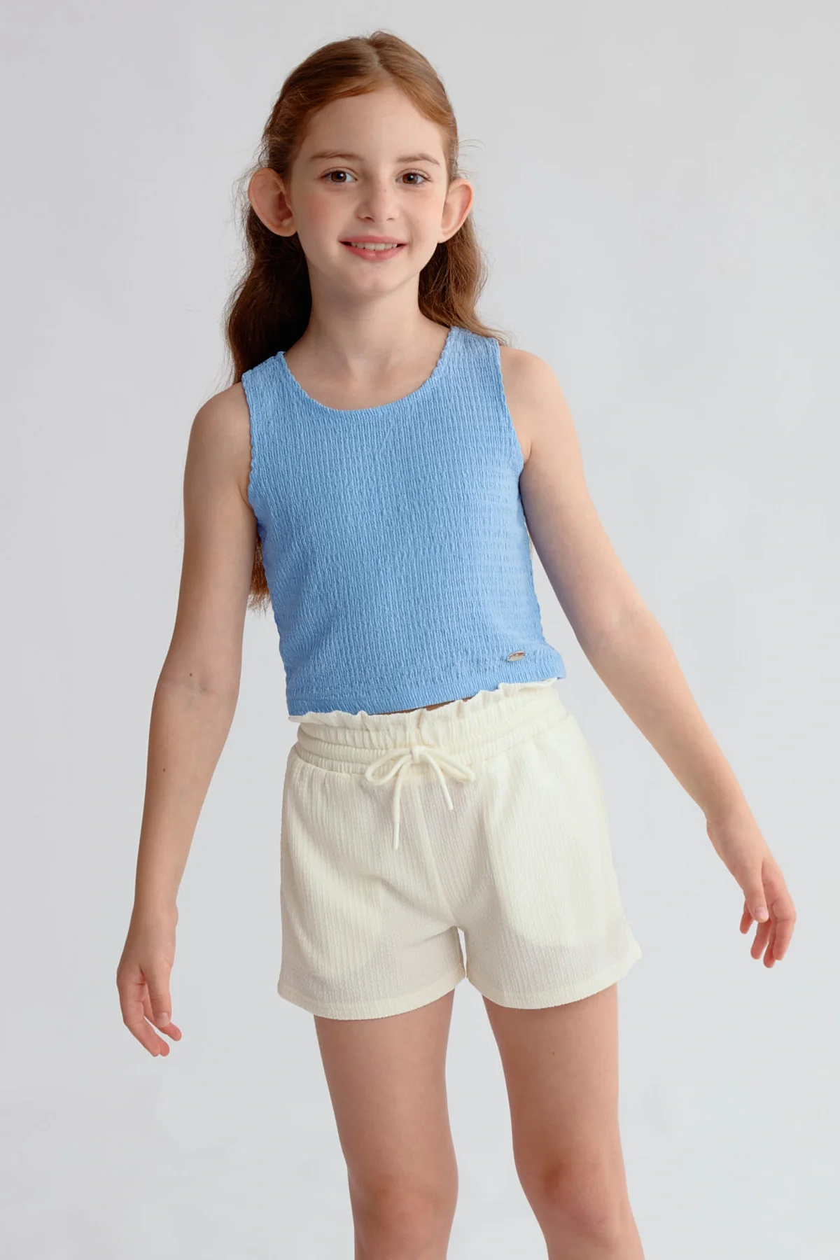 Polera Niña Textura Tipo Peto Celeste
